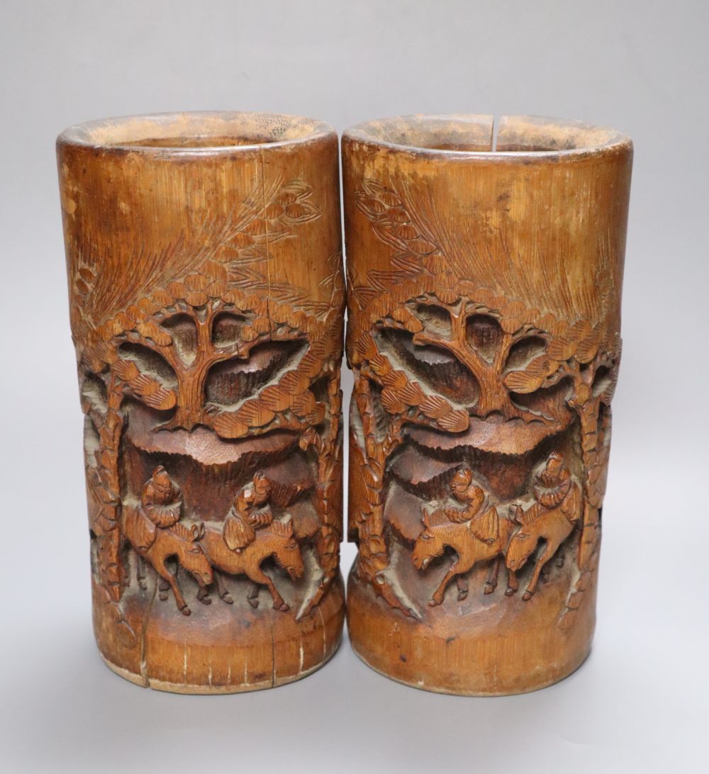 A pair of Chinese carved bamboo brush pots, height 22cm
